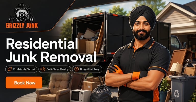 Man in black shirt with turban standing confidently in front of junk removal truck and residential house with piled items